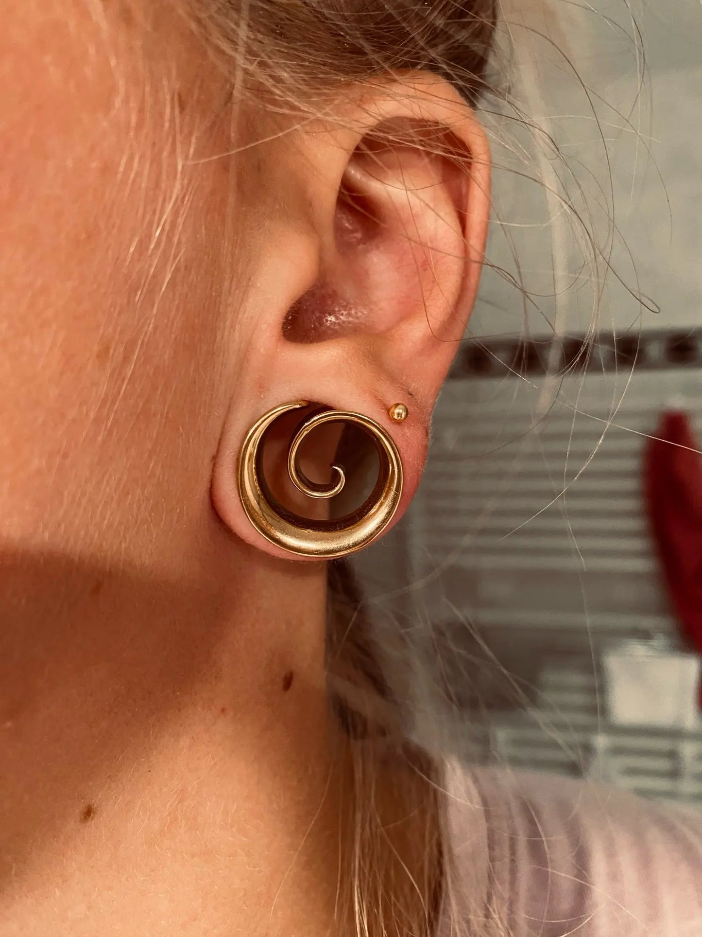 Oortunnel accessoire, spiraal voor een artistieke touch.