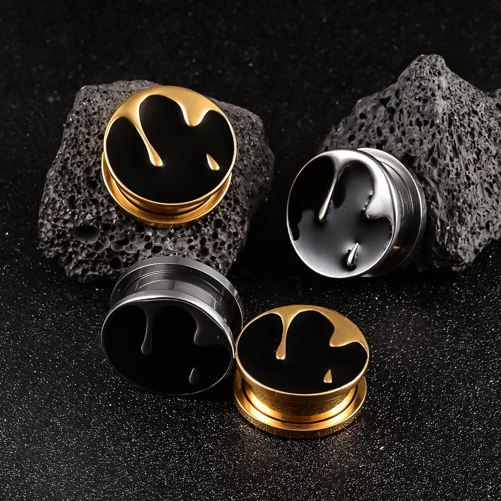 Oor spreider accessoire concha met uniek zwart en goud ontwerp.